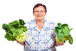 Happy senior woman with kohlrabi