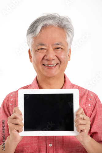 Photo: Studio Shot Of Chinese Senior Man Holding Digital Tablet Studio Shot Of Chinese Senior Man Holding Digital Tablet