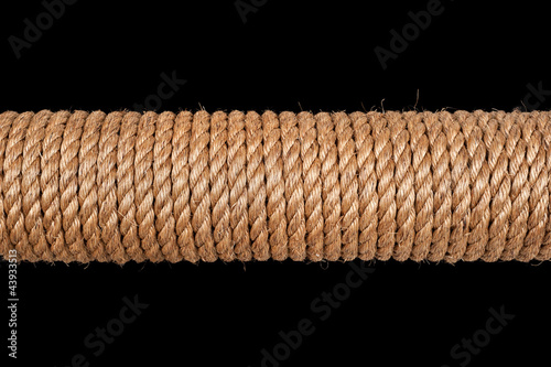 Photo: Spool of rope on black Spool of rope on black