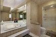 Master bath with mirrored tub