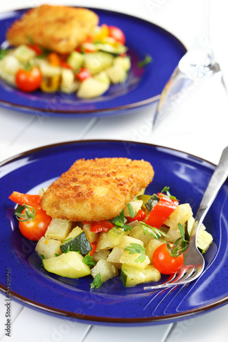 Photo: Fried fish fillet on vegetables Fried fish fillet on vegetables