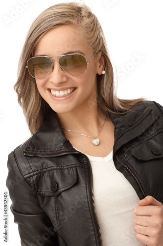 Photo: Happy girl in trendy leather jacket Happy girl in trendy leather jacket