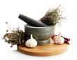 dried herbs in mortar and vegetables, isolatrd on white