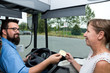 Photo: Busdriver and paying Woman laughing Busdriver and paying Woman laughing