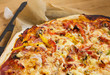 Italian pizza on baking sheet