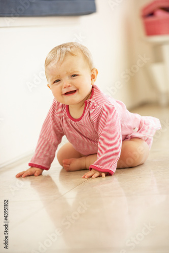 Photo: Unhappy Baby Girl Sitting On Floor Crying Unhappy Baby Girl Sitting On Floor Crying