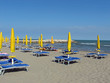 Photo: umbrellas and loungers and deckchairs umbrellas and loungers and deckchairs
