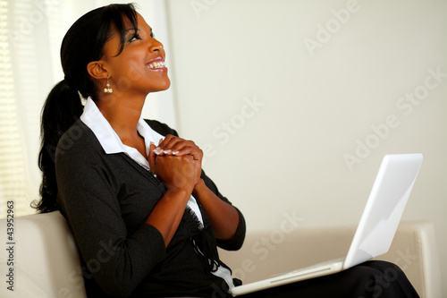 Photo: Beautiful business woman on black suit and smiling Beautiful business woman on black suit and smiling