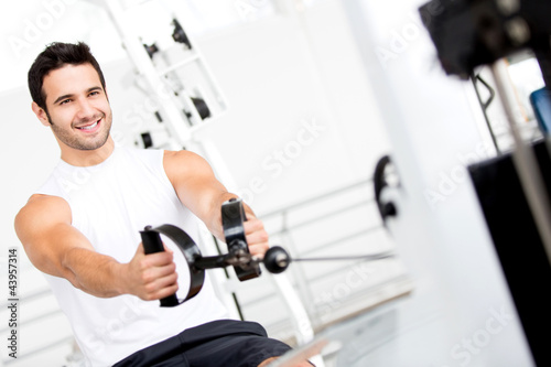 Photo: Man exercising at the gym Man exercising at the gym