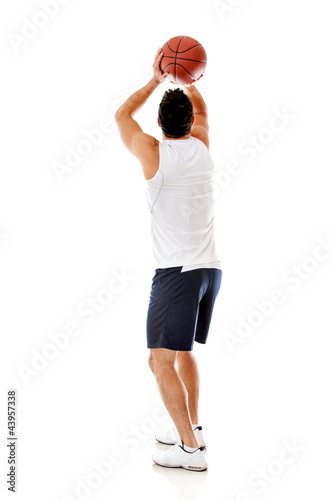 Photo: Man playing basketball Man playing basketball