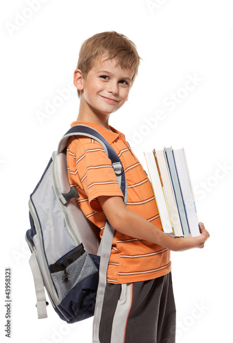 Photo: Boy holding books. Back to school Boy holding books. Back to school
