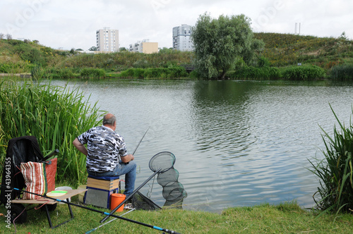 Photo: France, a fisherman near Sautour pond in Les Mureaux France, a fisherman near Sautour pond in Les Mureaux