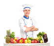 Photo: Male chef with fruits and vegetables on table Male chef with fruits and vegetables on table
