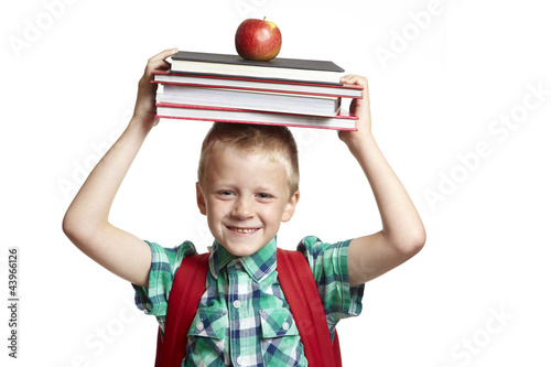Photo: 8 year old school boy with backpack on white background 8 year old school boy with backpack on white background