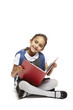 8 year old school girl sitting reading book on white background