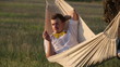 Video: Young man swinging on hammock at sunset Young man swinging on hammock at sunset