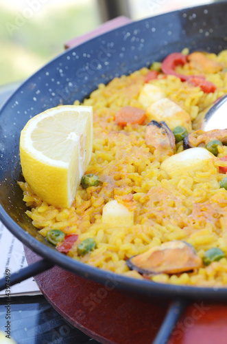 Photo: Spanish paella with seafood in a pan Spanish paella with seafood in a pan