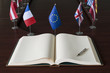 Open spread book, fountain pen, EU (European Union) flags