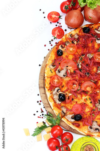 Photo: delicious pizza, vegetables and salami isolated on white. delicious pizza, vegetables and salami isolated on white.