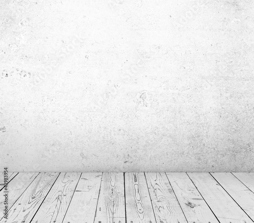 Photo: wooden floor and concrete wall wooden floor and concrete wall