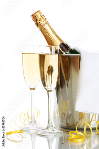Photo: Champagne bottle in bucket with ice and glasses of champagne, Champagne bottle in bucket with ice and glasses of champagne,