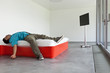 Photo: interior modern hotel room, guy lying on the bed interior modern hotel room, guy lying on the bed