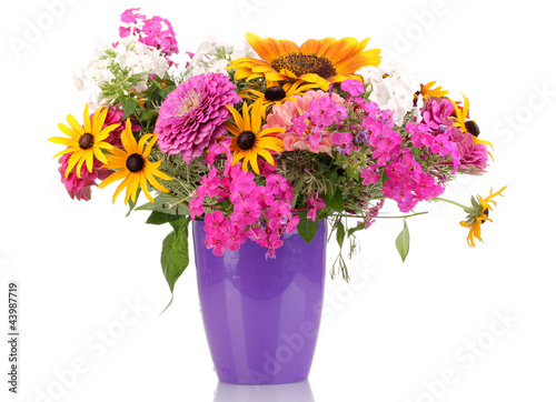 Photo: Beautiful bouquet of bright flowers isolated on white Beautiful bouquet of bright flowers isolated on white