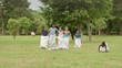 Elementary school children having fun and playing in park