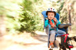 Photo: Little boy in bike child seat Little boy in bike child seat