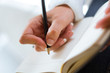 Photo: Woman writting hand with pencil Woman writting hand with pencil