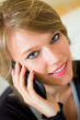 Photo: young pretty blonde woman with mobile at home young pretty blonde woman with mobile at home
