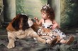 Adorable Child and Her Saint Bernard Puppy Dog