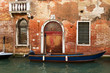 Photo: Ancient brick building on a canal in Venice. Ancient brick building on a canal in Venice.