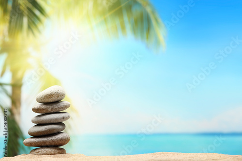 Photo: Stack of zen stones on sand beach Stack of zen stones on sand beach