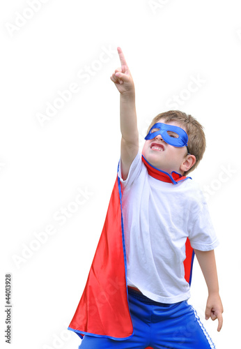Photo: Super Hero Boy Pointing on White Background Super Hero Boy Pointing on White Background