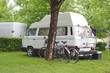 camper and bicycles on a camping site