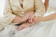 Bride's and her mother's hands