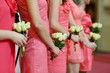Row of bridesmaids with bouquets at wedding