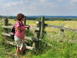 Lady Rambler standing by a Stile