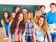 Group student near blackboard.
