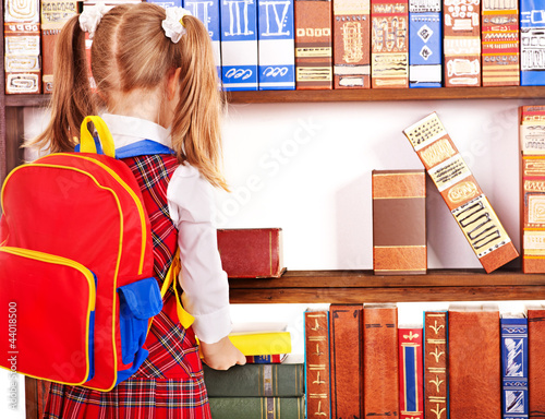 Photo: Child with stack book. Child with stack book.