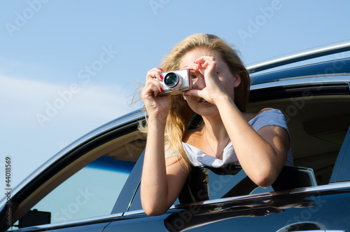 Photo: Photographer leaning out of car window Photographer leaning out of car window