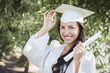 Photo: Graduating Mixed Race Girl In Cap and Gown with Diploma Graduating Mixed Race Girl In Cap and Gown with Diploma