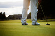 Photo: Golfer putting Golfer putting
