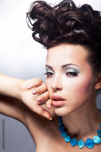 Photo: Sensual woman gazing. Fashion style. Bright coiffure and make-up Sensual woman gazing. Fashion style. Bright coiffure and make-up
