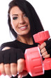Beautiful brunette working out with dumbbells