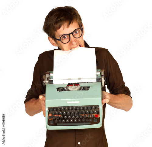 Photo: Man Pulling Paper from a Vintage Typerwriter with his Teeth Man Pulling Paper from a Vintage Typerwriter with his Teeth