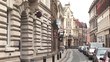 Video: One way street with cars parked and pedestrians on sidewalk One way street with cars parked and pedestrians on sidewalk