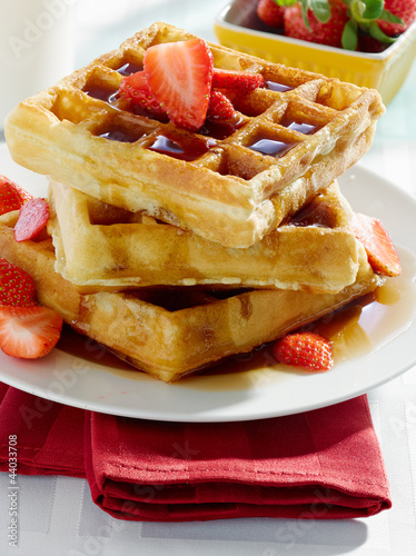 Photo: breakfast - waffles with syrup and strawberries breakfast - waffles with syrup and strawberries
