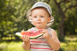 Charming babe with a big slice of watermelon